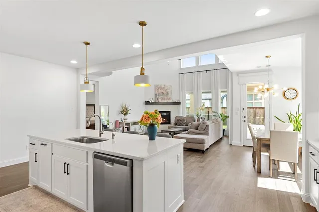 a view of living room with furniture and wooden floor
