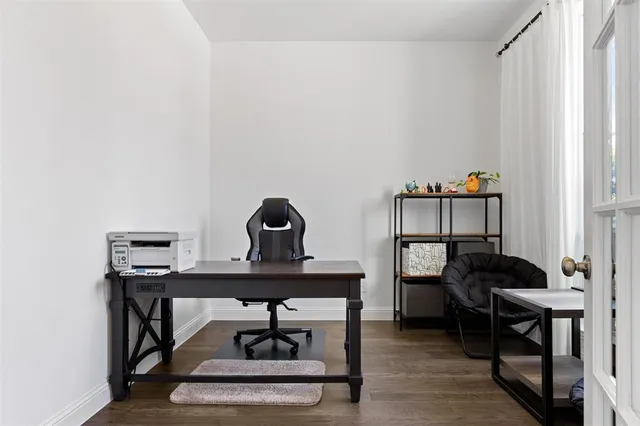 a view of a workspace with furniture