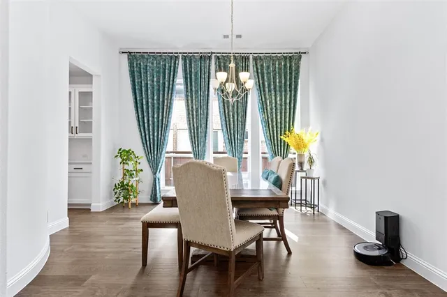 a view of a dining room with furniture and a window