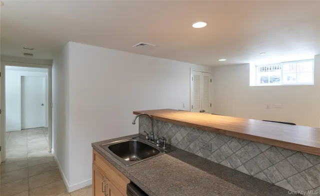 a view of a room with wooden walls