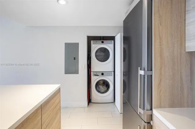 a utility room with sink dryer and washer