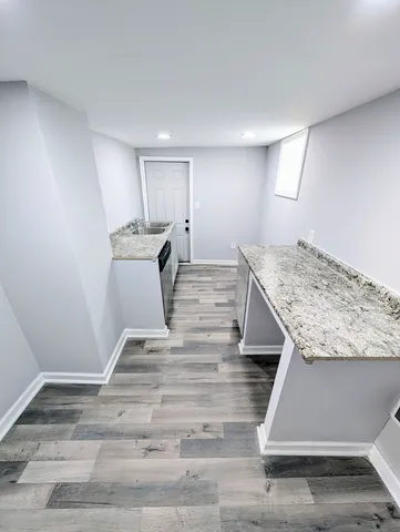 a view of kitchen and wooden floor