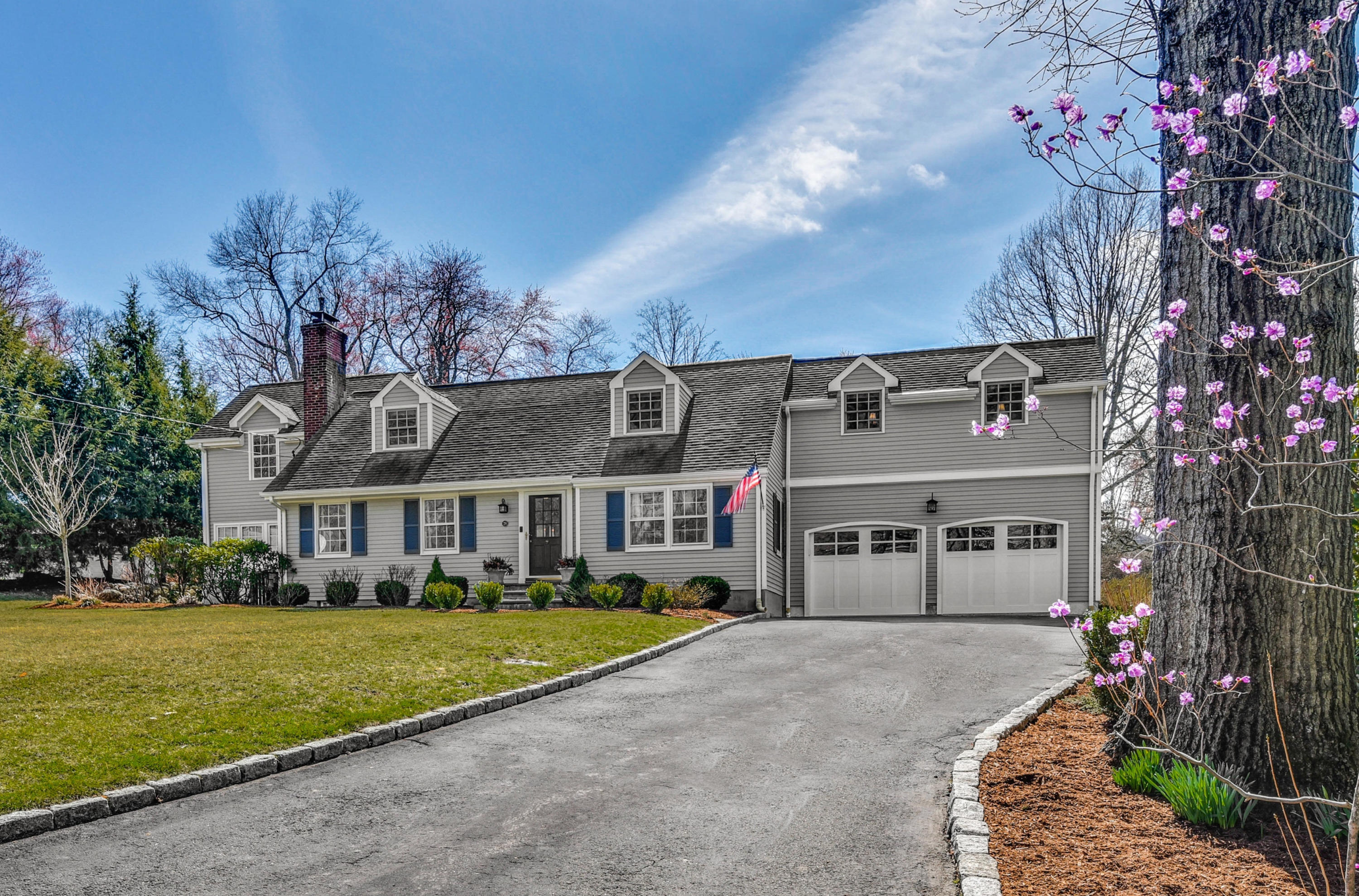 28 Briar Brae Road Darien, CT 06820 - Photo 1 of 33 a front view of a house with a garden and tree