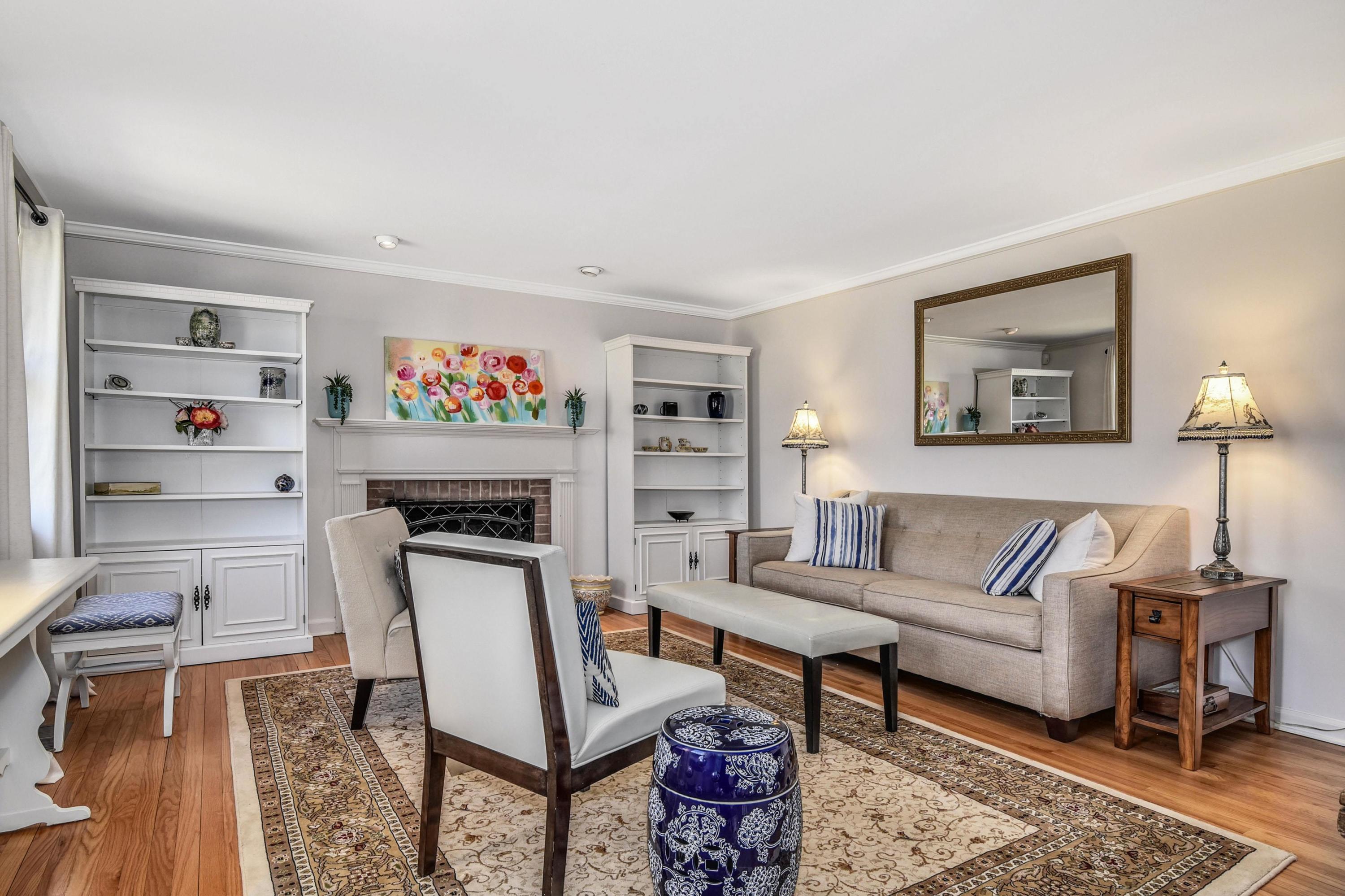 28 Briar Brae Road Darien, CT 06820 - Photo 11 of 33 a living room with furniture and a painting