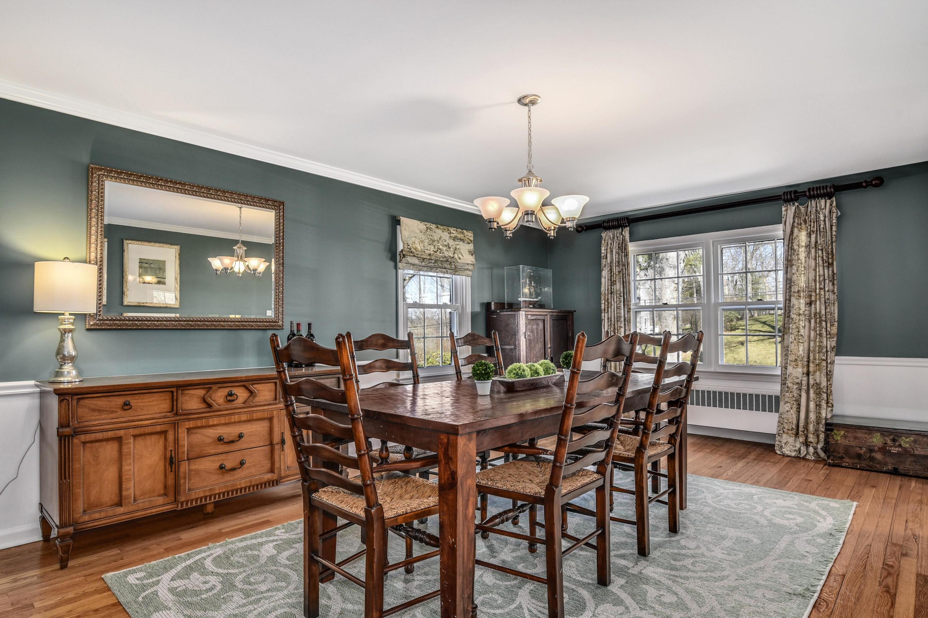 28 Briar Brae Road Darien, CT 06820 - Photo 12 of 33 a view of a dining room with furniture and wooden floor