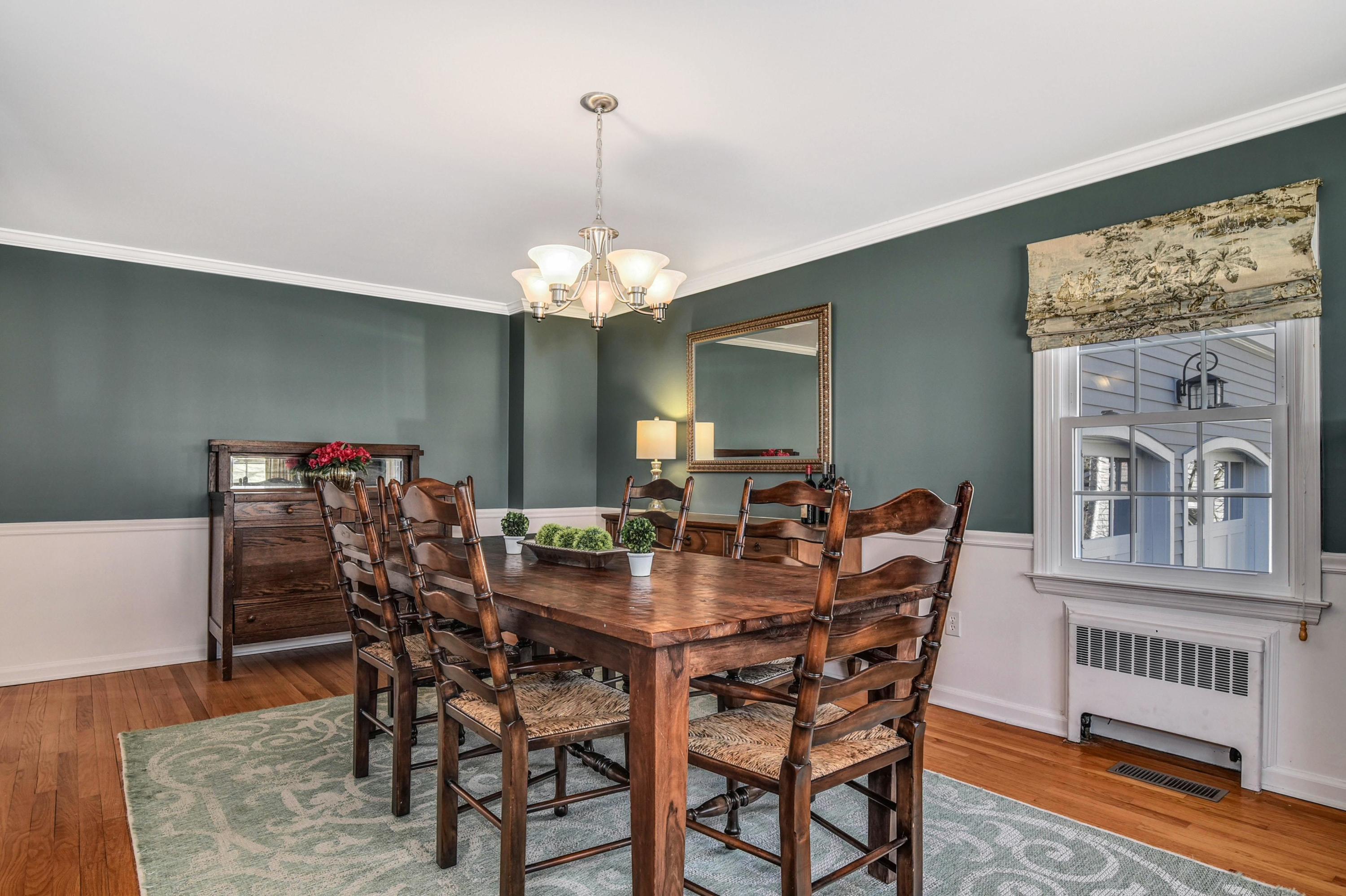 28 Briar Brae Road Darien, CT 06820 - Photo 13 of 33 a view of a dining room with furniture wooden floor and chandelier