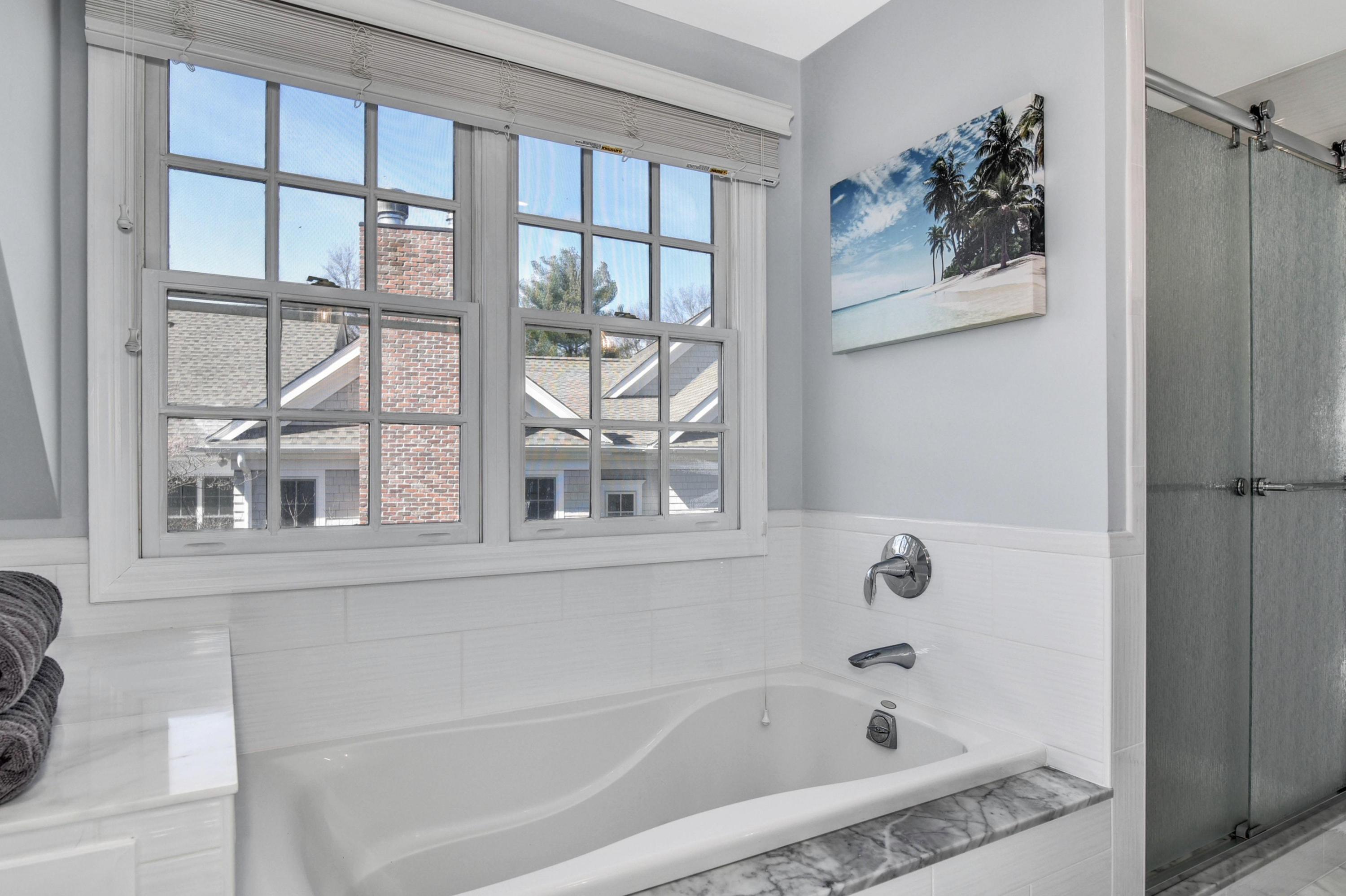 28 Briar Brae Road Darien, CT 06820 - Photo 17 of 33 a white bath tub sitting next to a window