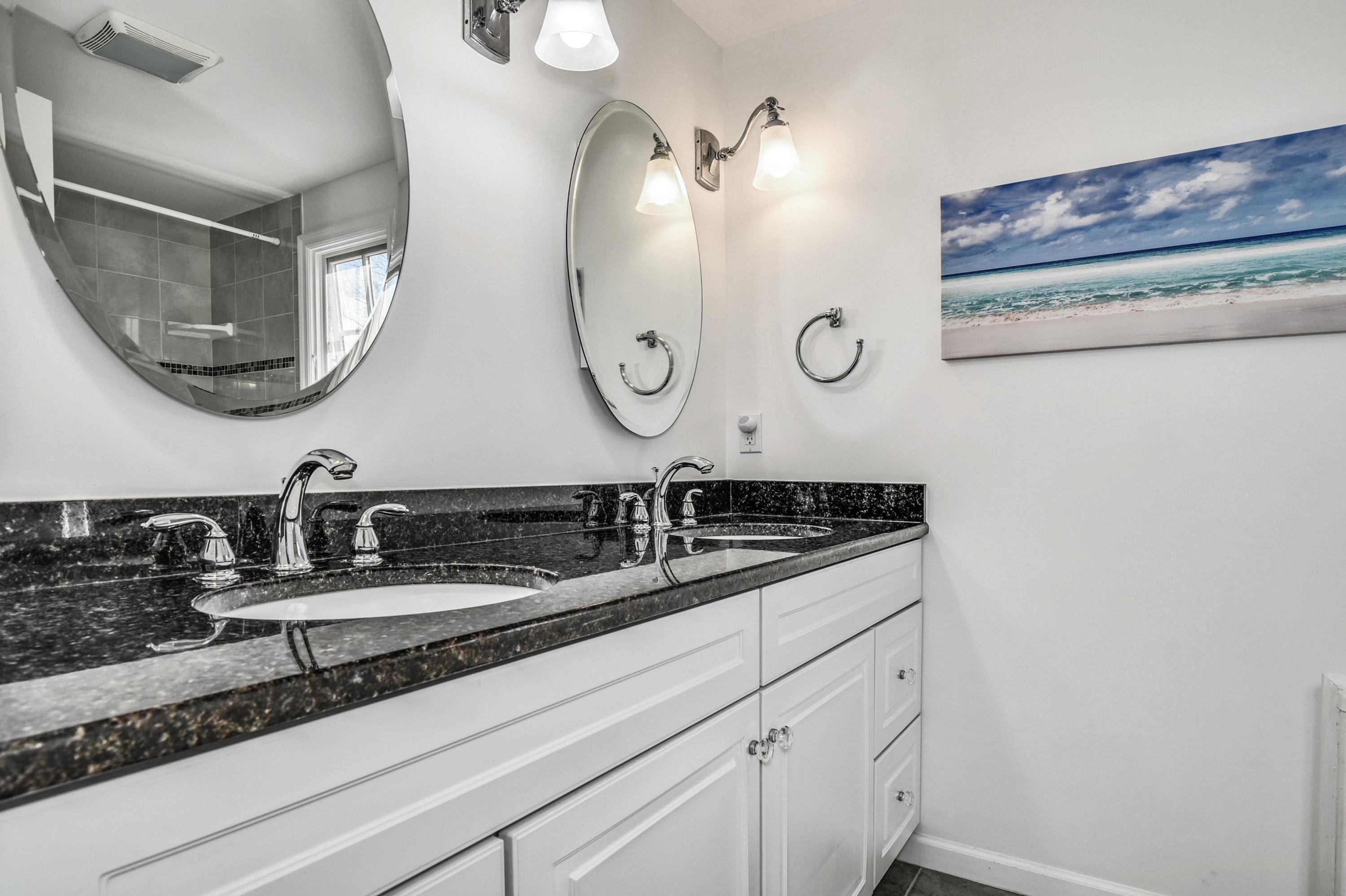 28 Briar Brae Road Darien, CT 06820 - Photo 22 of 33 a bathroom with a sink and a mirror