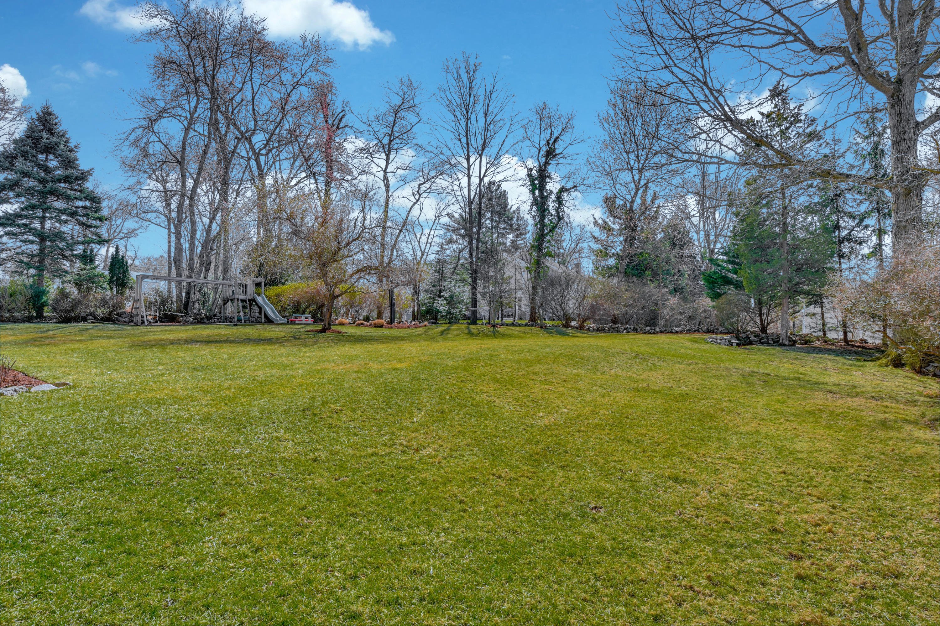 28 Briar Brae Road Darien, CT 06820 - Photo 27 of 33 a view of a field of grass and trees