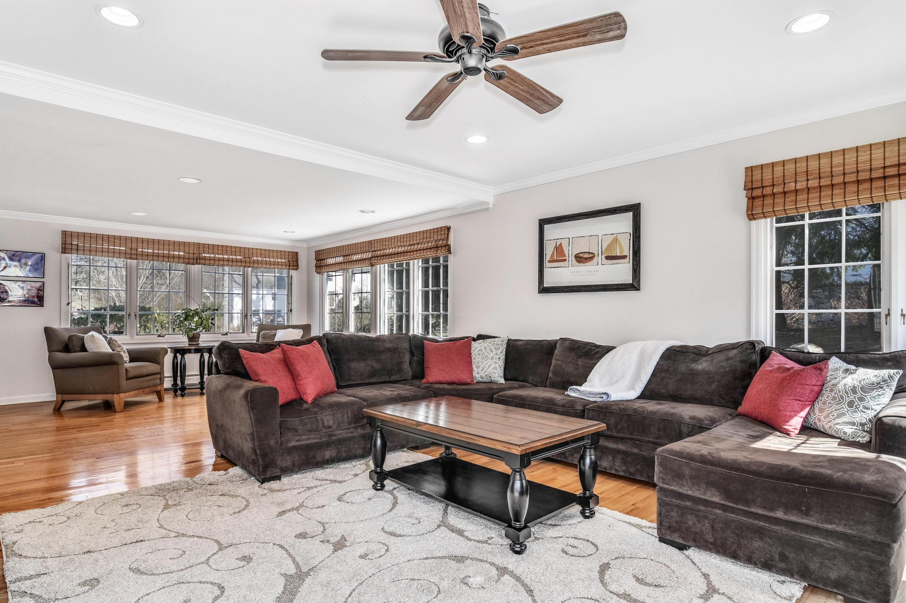 28 Briar Brae Road Darien, CT 06820 - Photo 6 of 33 a living room with furniture a rug and a window