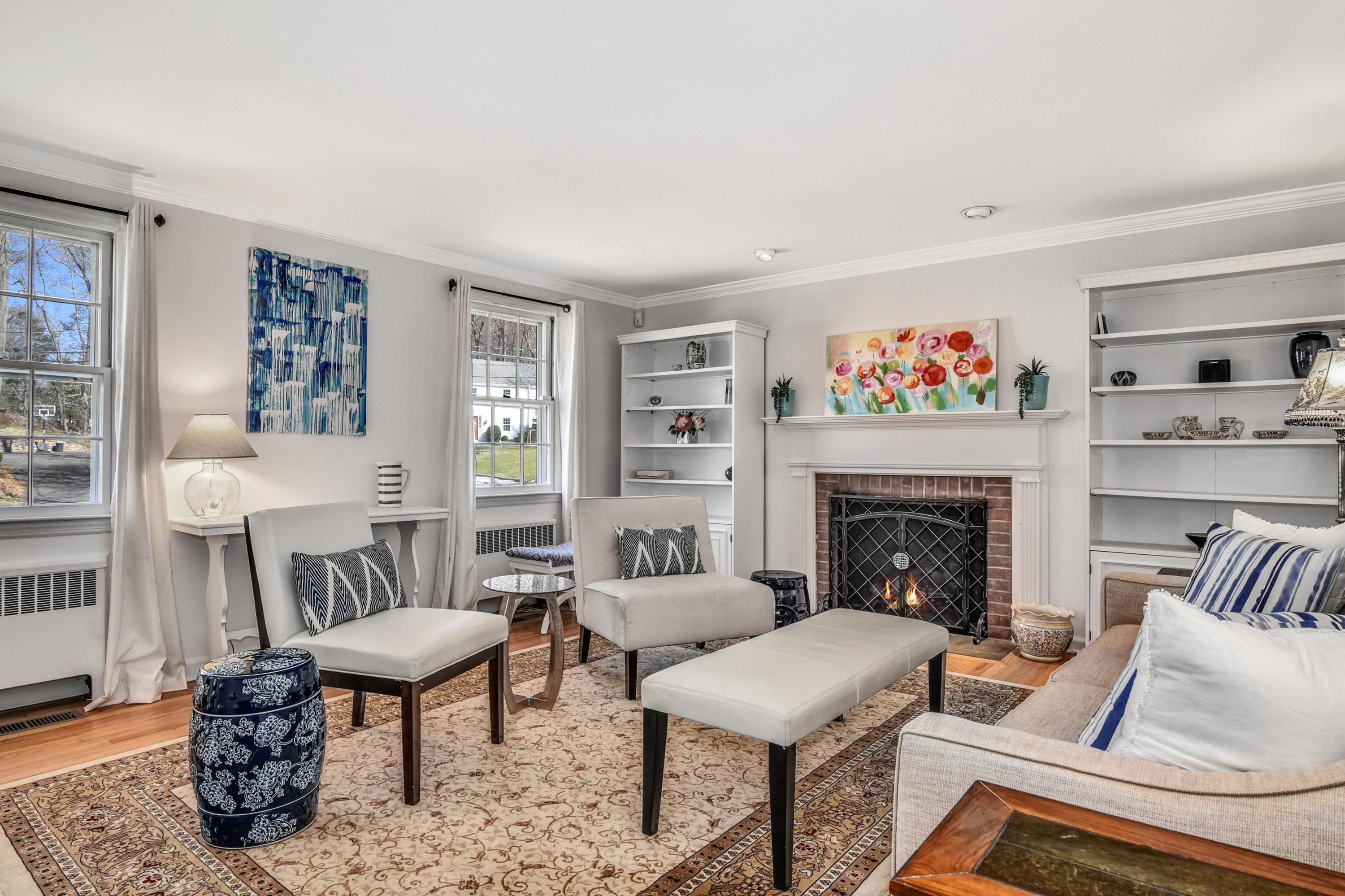 28 Briar Brae Road Darien, CT 06820 - Photo 10 of 33 a living room with furniture and a fireplace