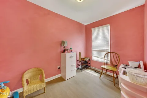 a bedroom with bed and a walk in closet