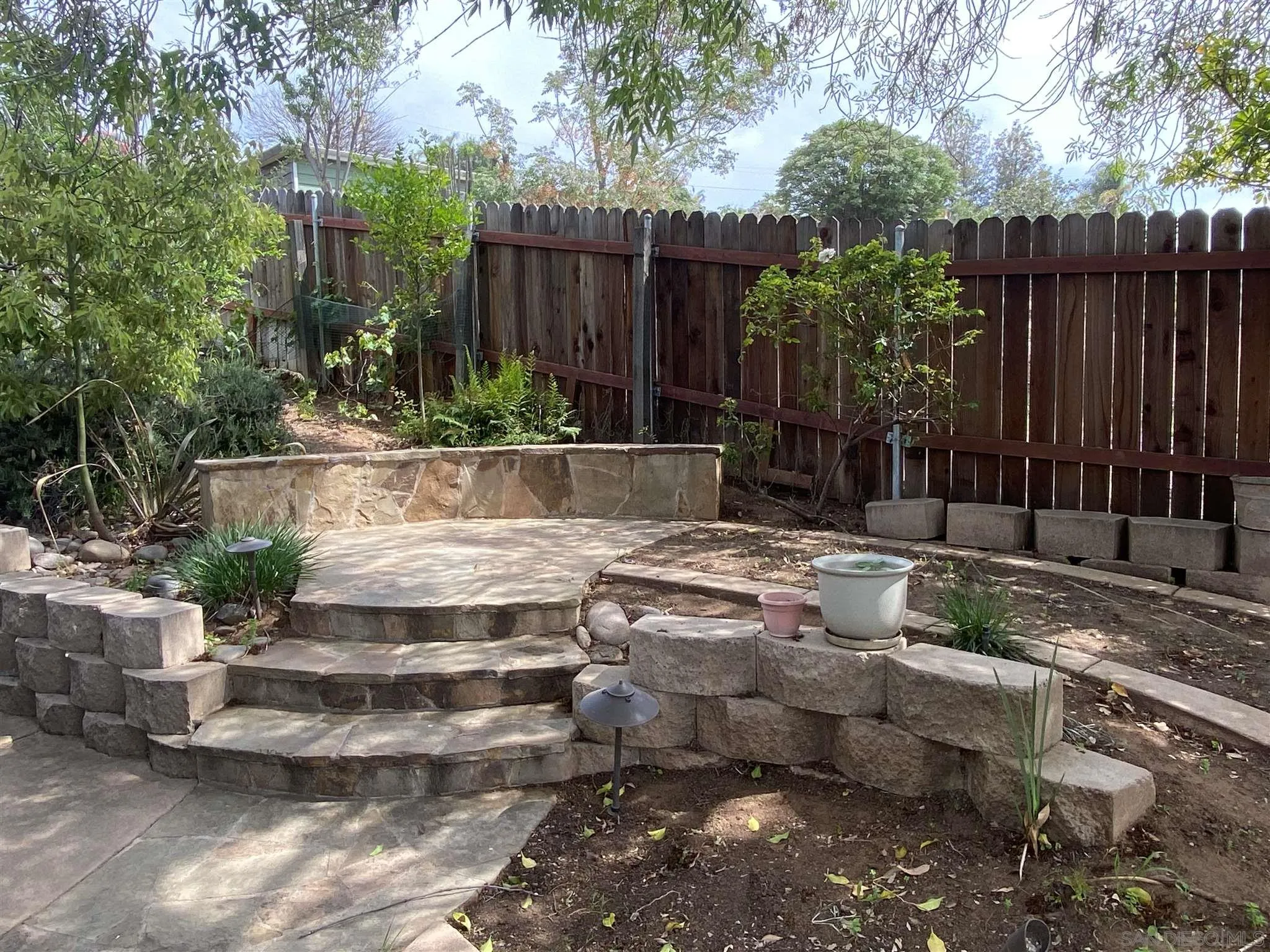 9243 Westhill Road Lakeside, CA 92040 - Photo 10 of 26 a view of a backyard with plants and tree