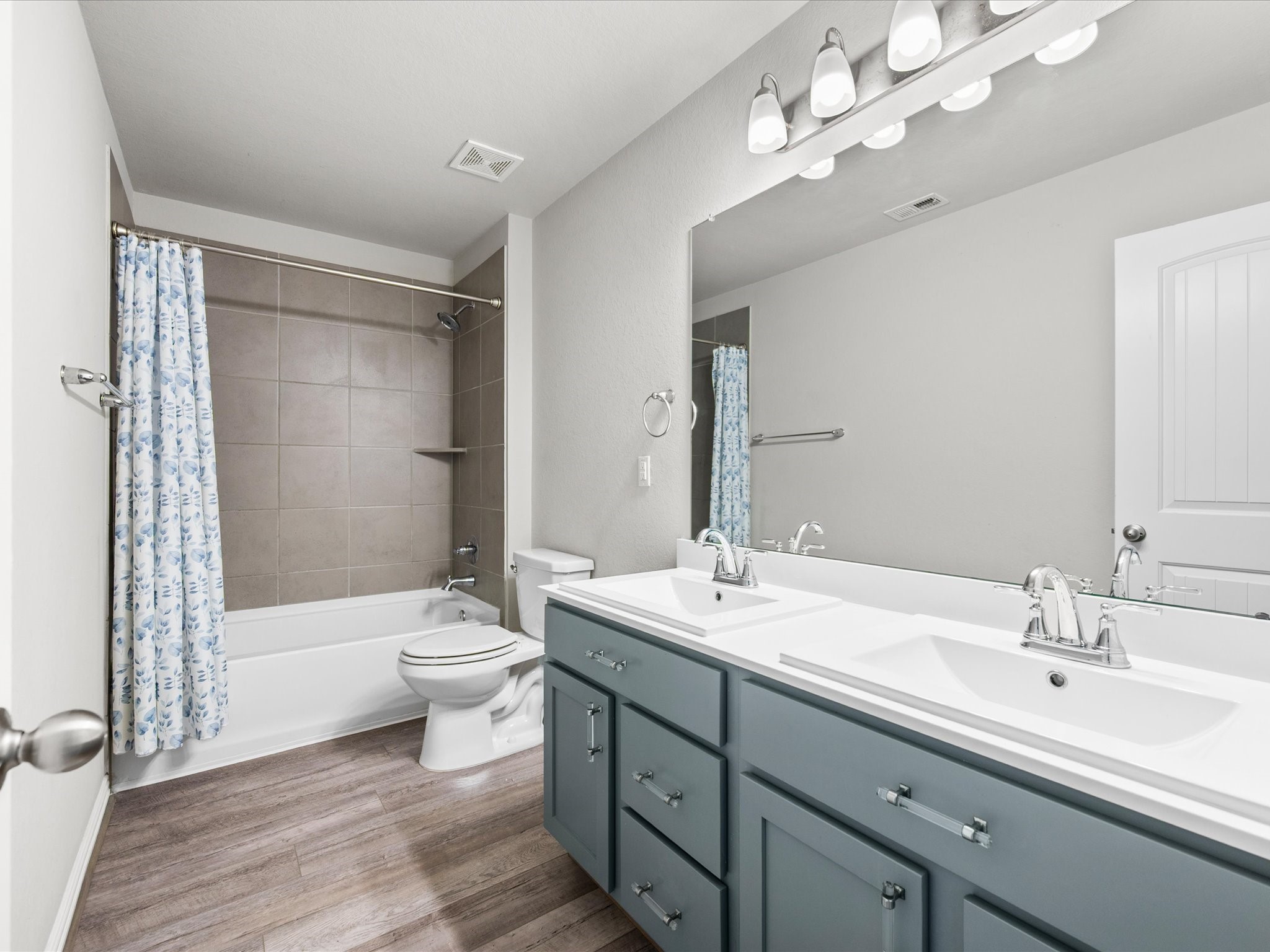 7123 Poppyseed Trail Spring, TX 77379 - Photo 22 of 30 The upstairs full bath features dual sinks and a convenient tub/shower combination, offering comfort and functionality for family and guests alike.