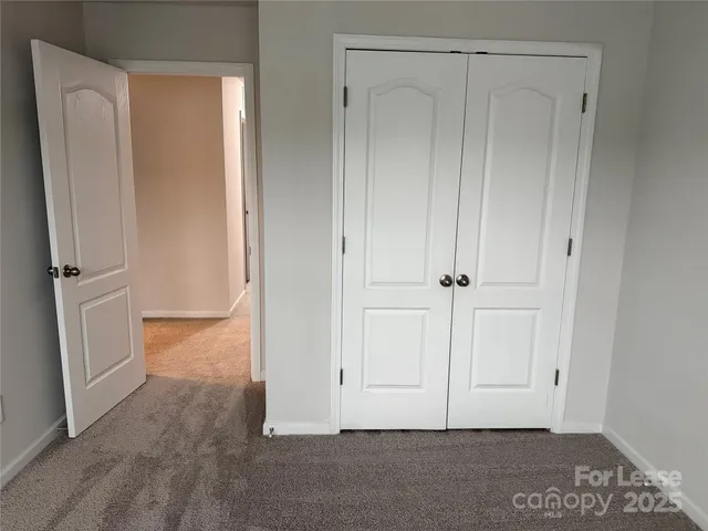 a view of room with hardwood floor