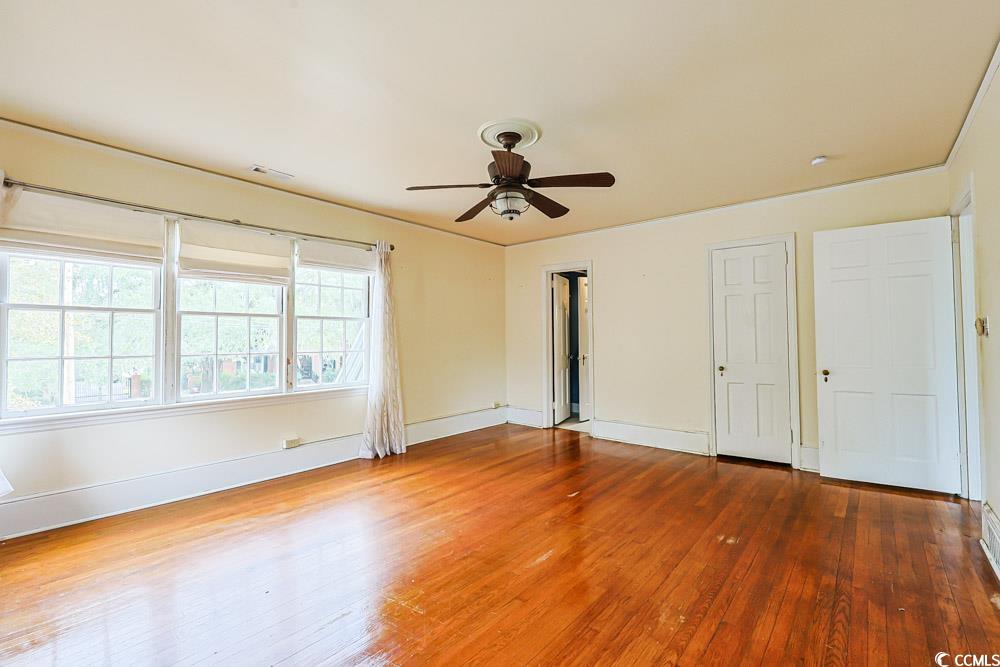 509 Beaty Street Conway, SC 29526 - Photo 17 of 40 Unfurnished bedroom featuring wood-type flooring and a ceiling fan