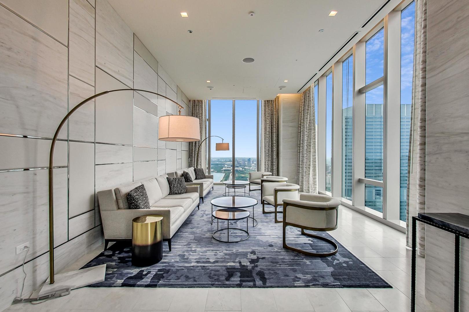 363 East Wacker Drive, Unit 2708 Chicago, IL 60601 - Photo 27 of 48 a living room with patio furniture and a rug