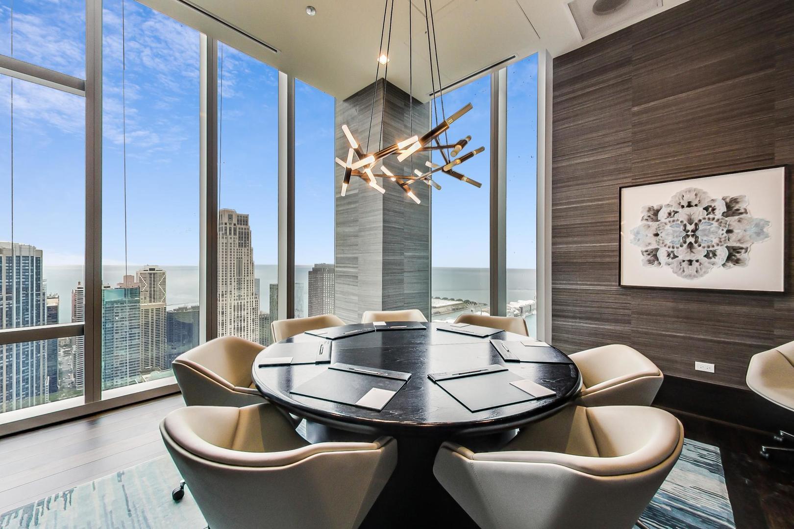 363 East Wacker Drive, Unit 2708 Chicago, IL 60601 - Photo 33 of 48 a kitchen with a table and chairs