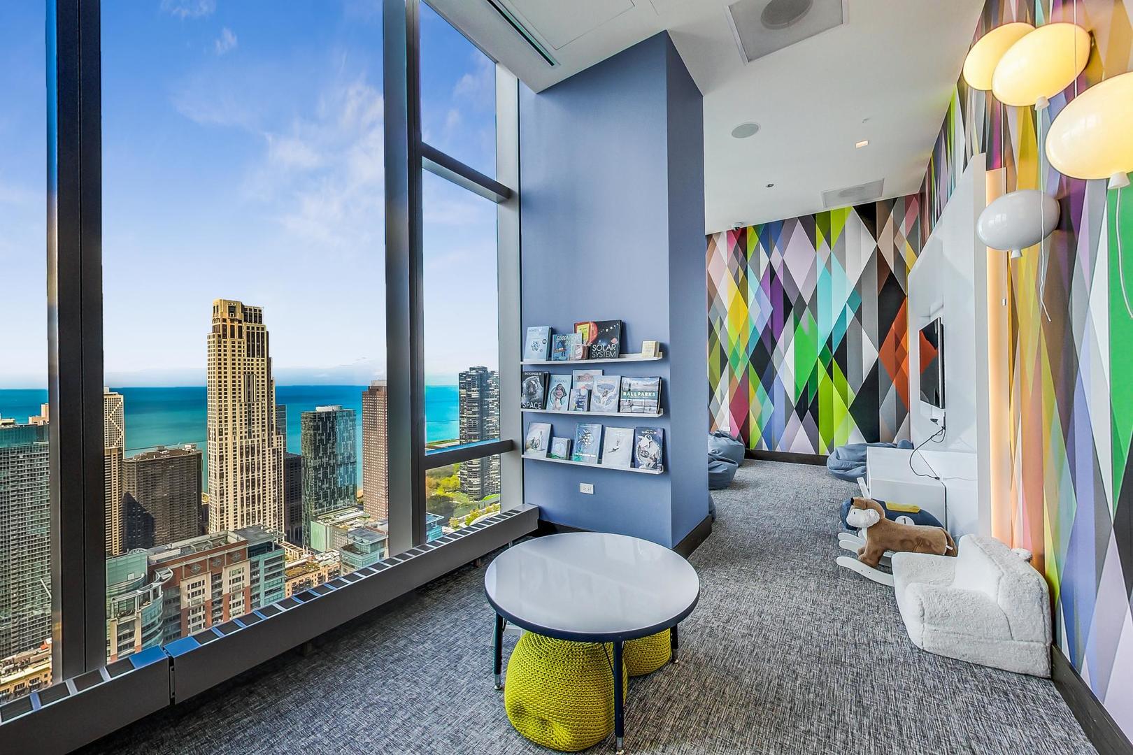 363 East Wacker Drive, Unit 2708 Chicago, IL 60601 - Photo 37 of 48 a living room with furniture and a floor to ceiling window