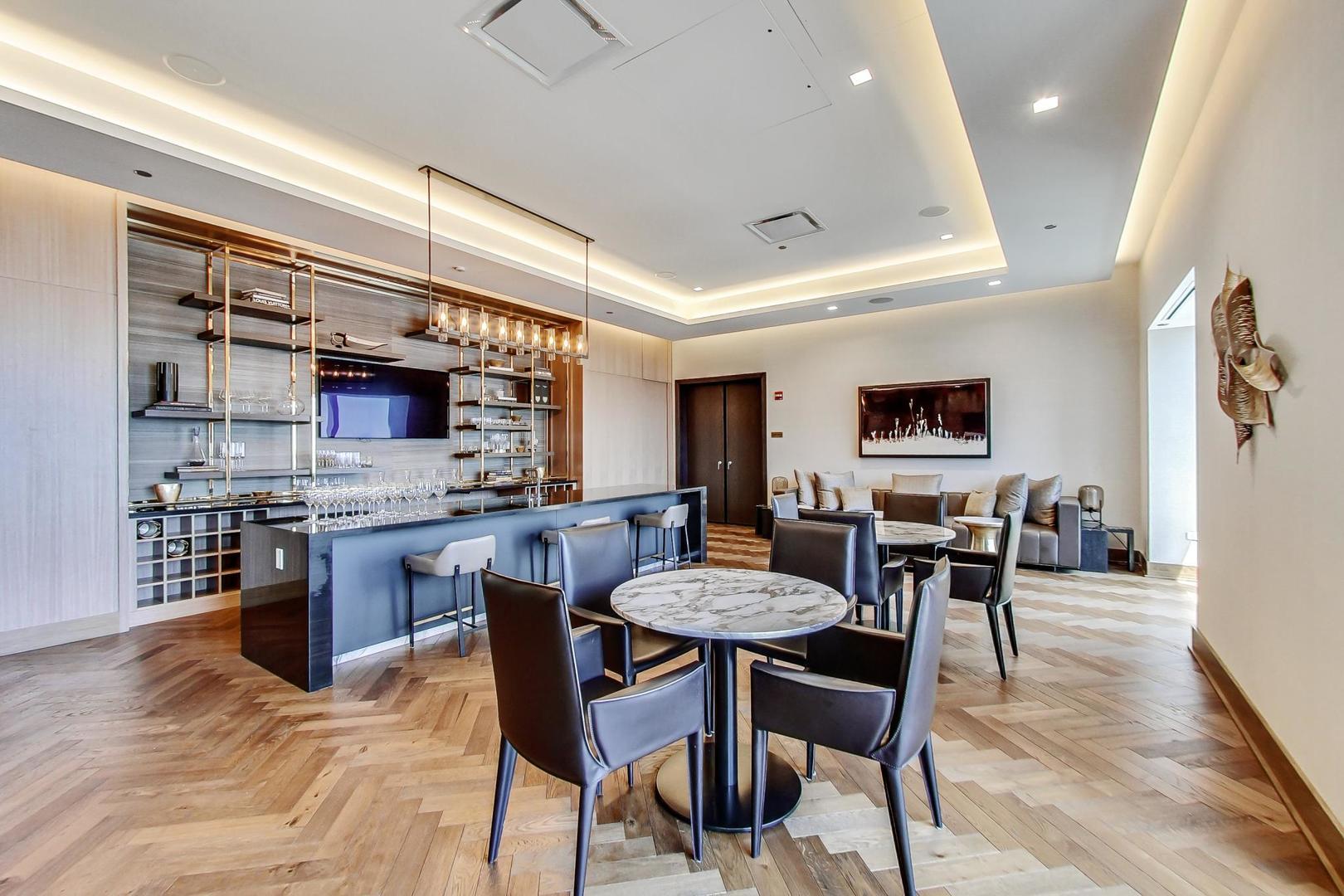 363 East Wacker Drive, Unit 2708 Chicago, IL 60601 - Photo 39 of 48 a view of a dining room with furniture