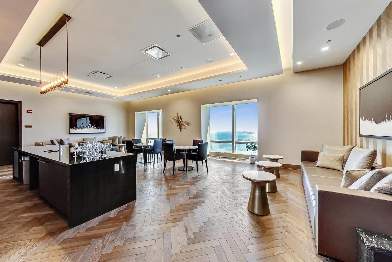 363 East Wacker Drive, Unit 2708 Chicago, IL 60601 - Photo 40 of 48 a view of a dining room with furniture window and wooden floor