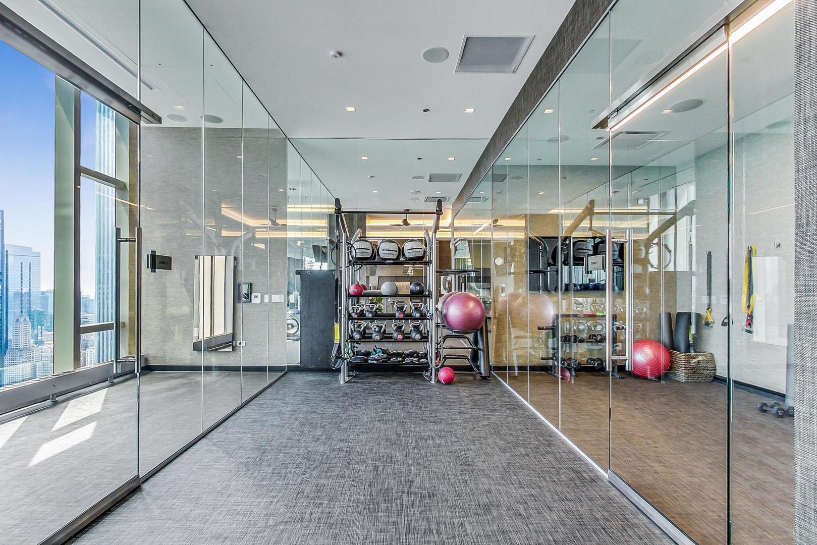 363 East Wacker Drive, Unit 2708 Chicago, IL 60601 - Photo 44 of 48 a view of a room with gym equipment