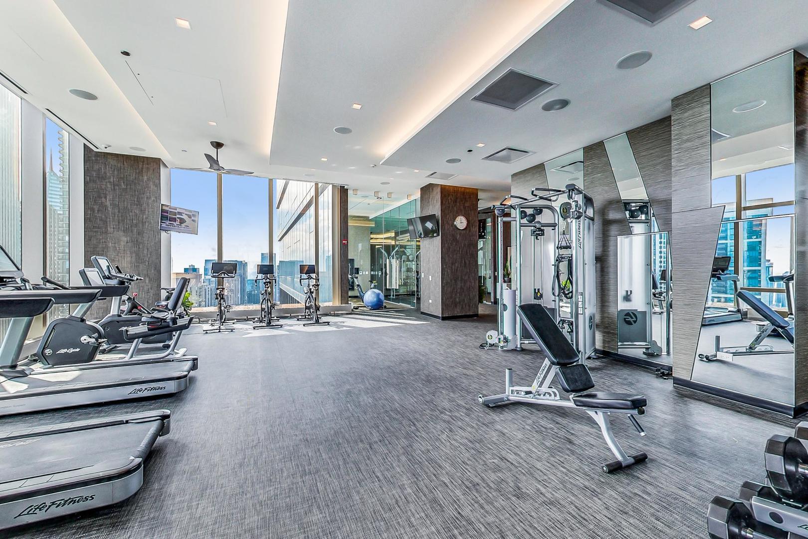 363 East Wacker Drive, Unit 2708 Chicago, IL 60601 - Photo 45 of 48 a view of a room with gym equipment