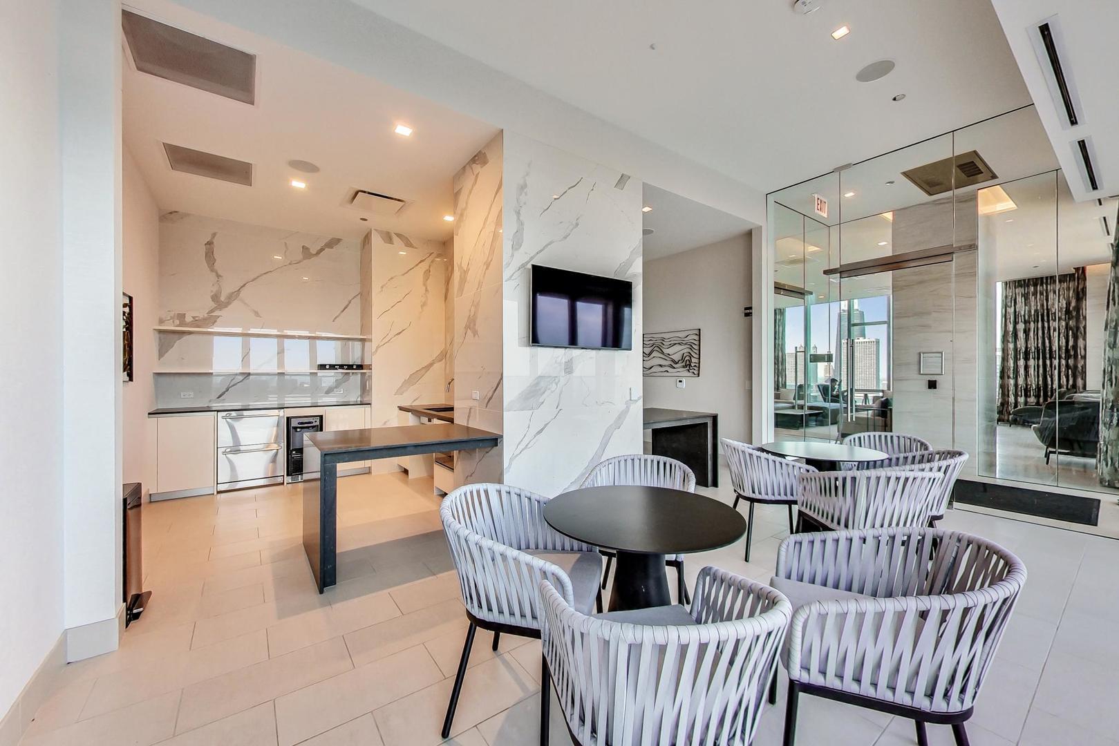 363 East Wacker Drive, Unit 2708 Chicago, IL 60601 - Photo 48 of 48 a dining room with furniture and wooden floor