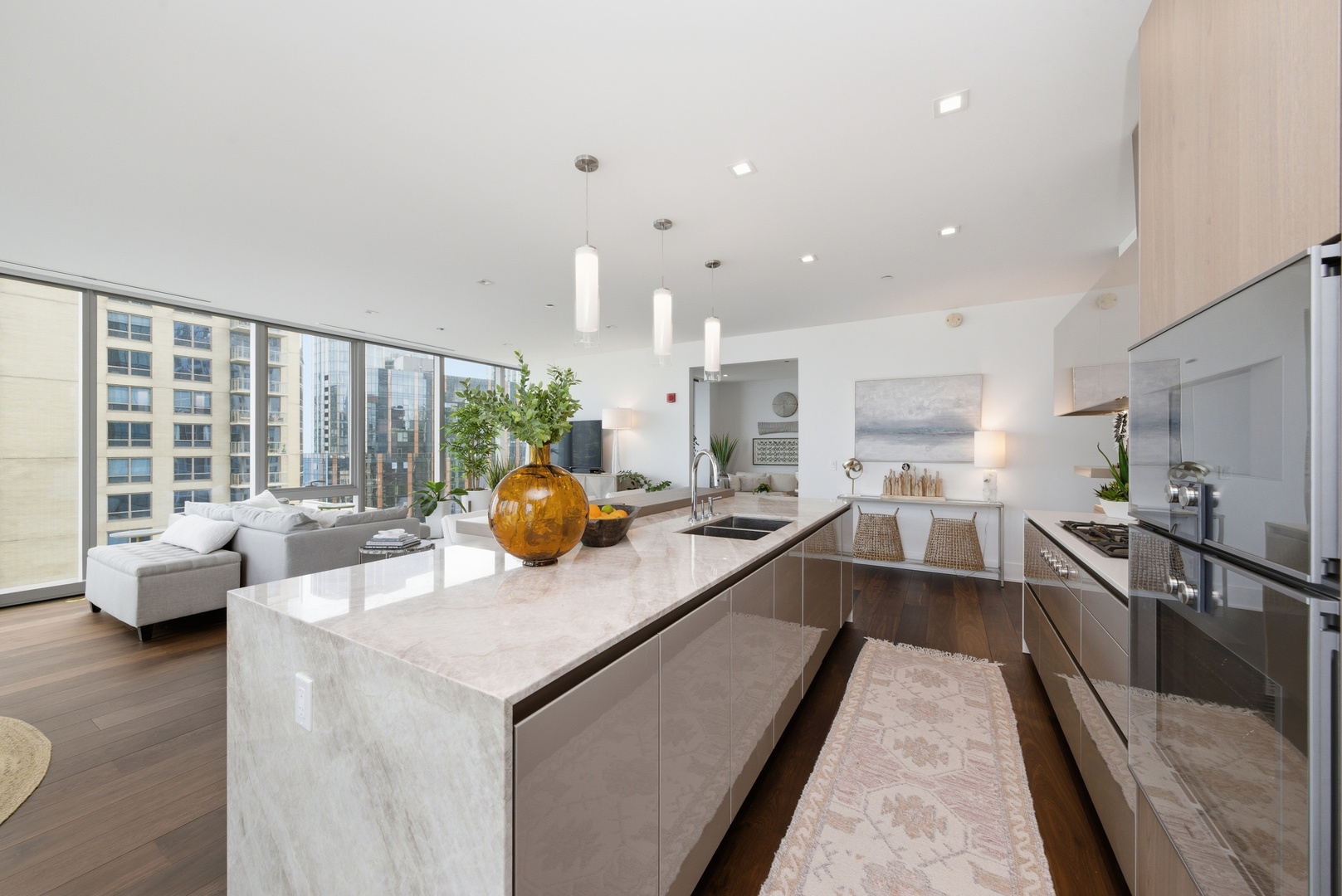 363 East Wacker Drive, Unit 2708 Chicago, IL 60601 - Photo 8 of 48 a kitchen with stainless steel appliances a sink stove and cabinets