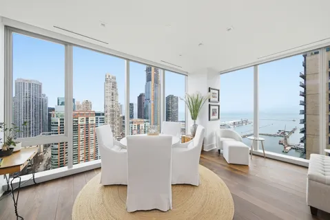 a en suite bathroom with a double vanity sink a mirror and a shower