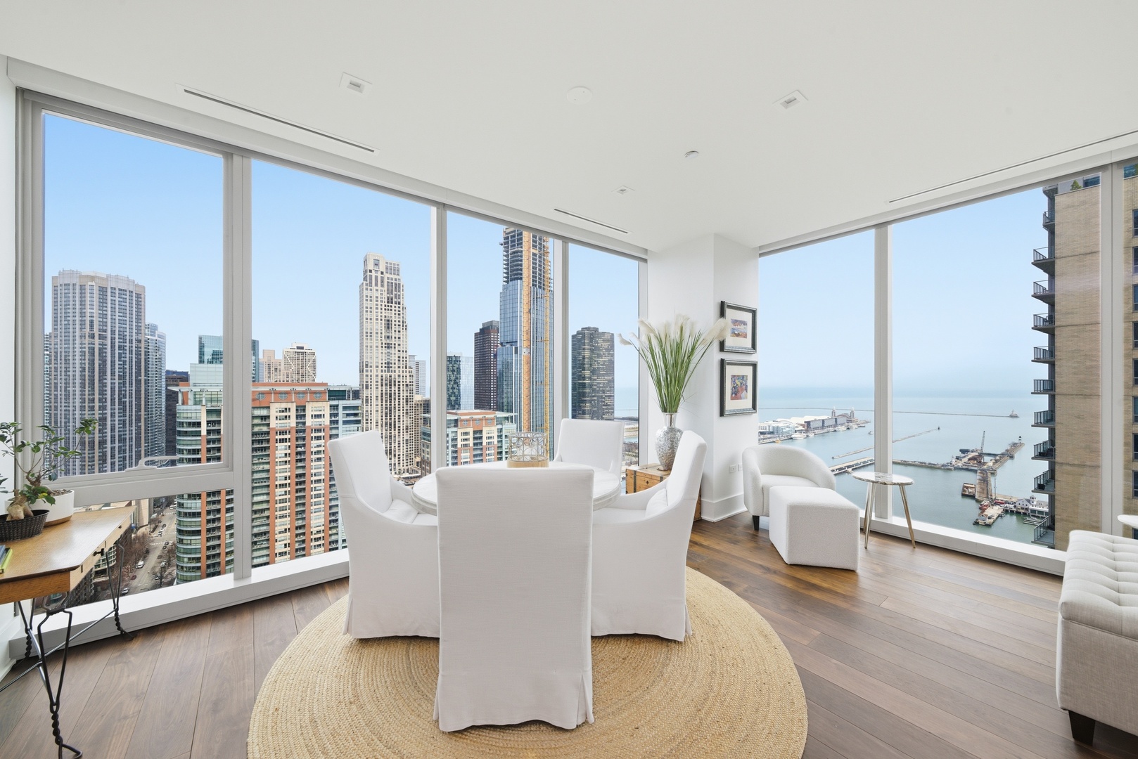 363 East Wacker Drive, Unit 2708 Chicago, IL 60601 - Photo 9 of 48 a living room with furniture and a large window