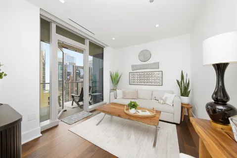 a bedroom with furniture and a flat screen tv