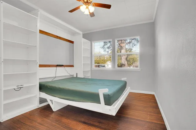 a room with a bed and a window