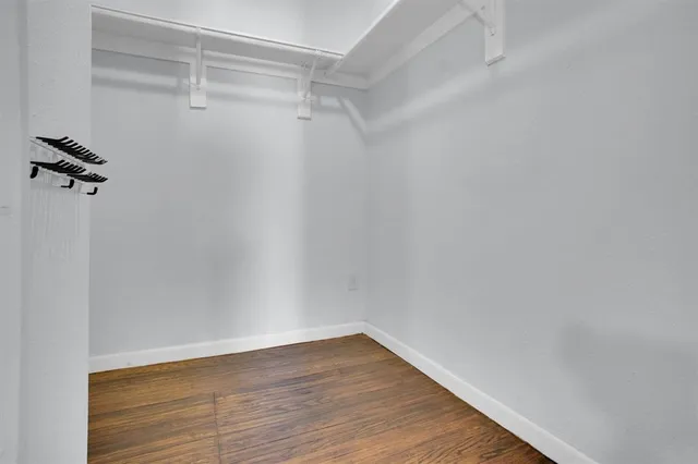 a view of an empty walk in closet