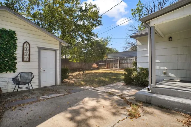 a view of a backyard with sitting area