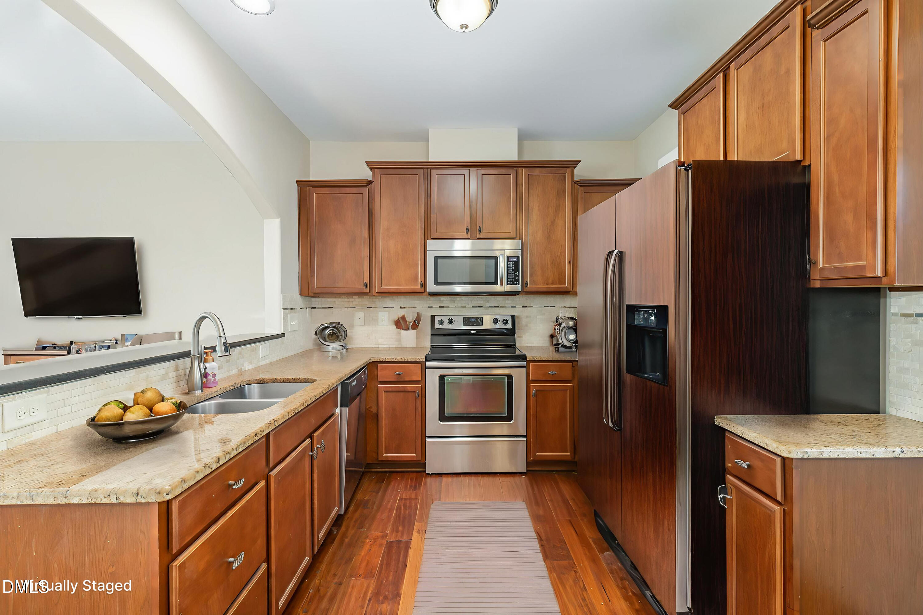 3827 Glenhaven Road Raleigh, NC 27606 - Photo 11 of 32 a kitchen with a refrigerator stove and sink
