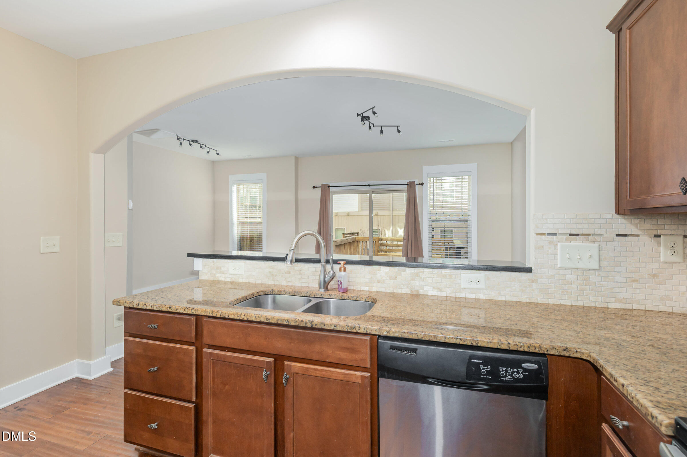 3827 Glenhaven Road Raleigh, NC 27606 - Photo 12 of 32 a sink with granite countertop a sink and cabinets