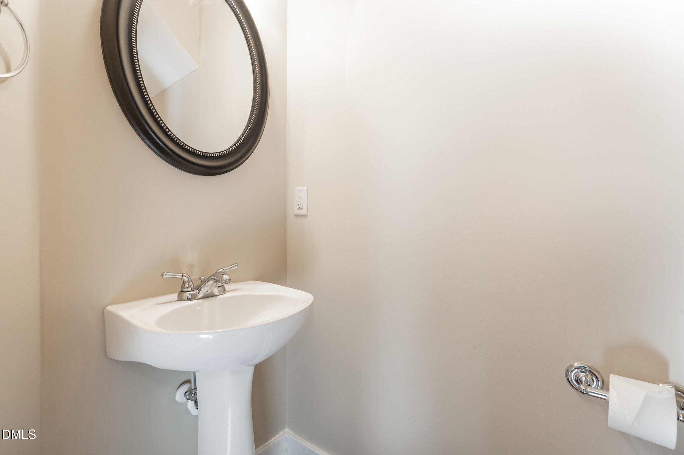 3827 Glenhaven Road Raleigh, NC 27606 - Photo 15 of 32 a bathroom with a sink and a mirror