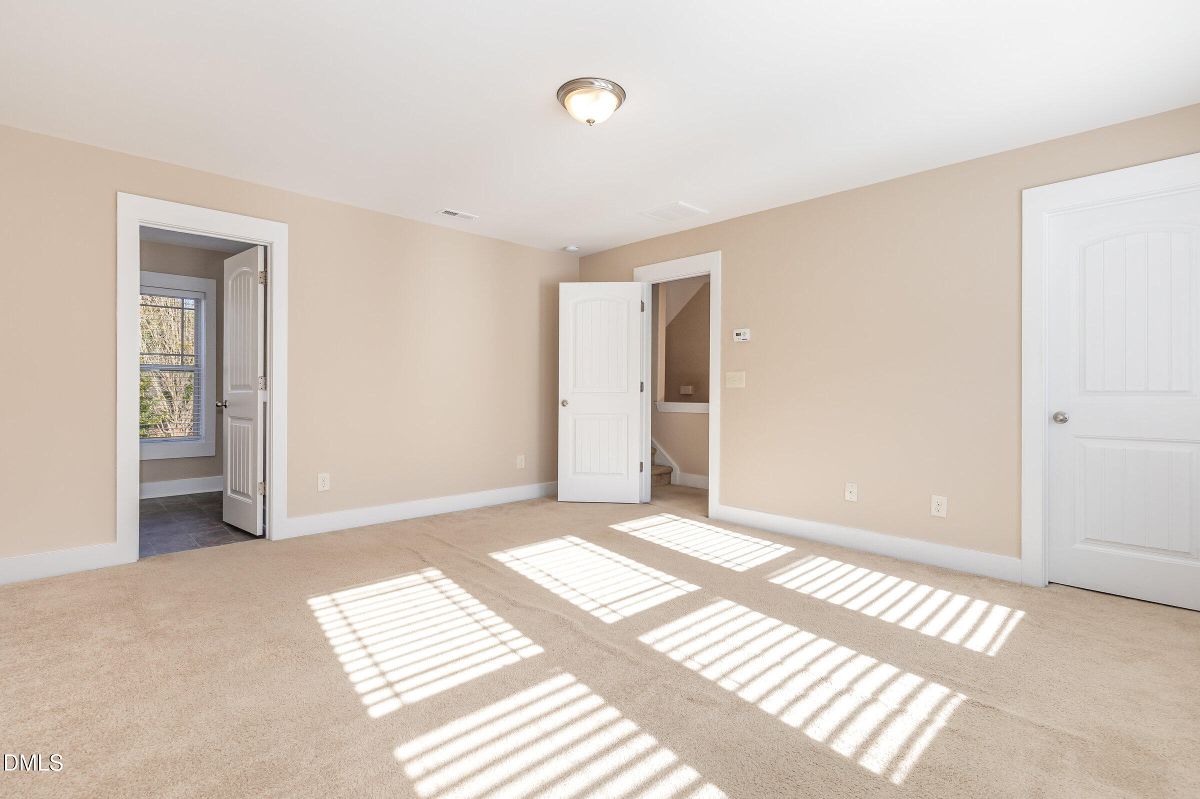 3827 Glenhaven Road Raleigh, NC 27606 - Photo 16 of 32 a view of a room with wooden floor and windows