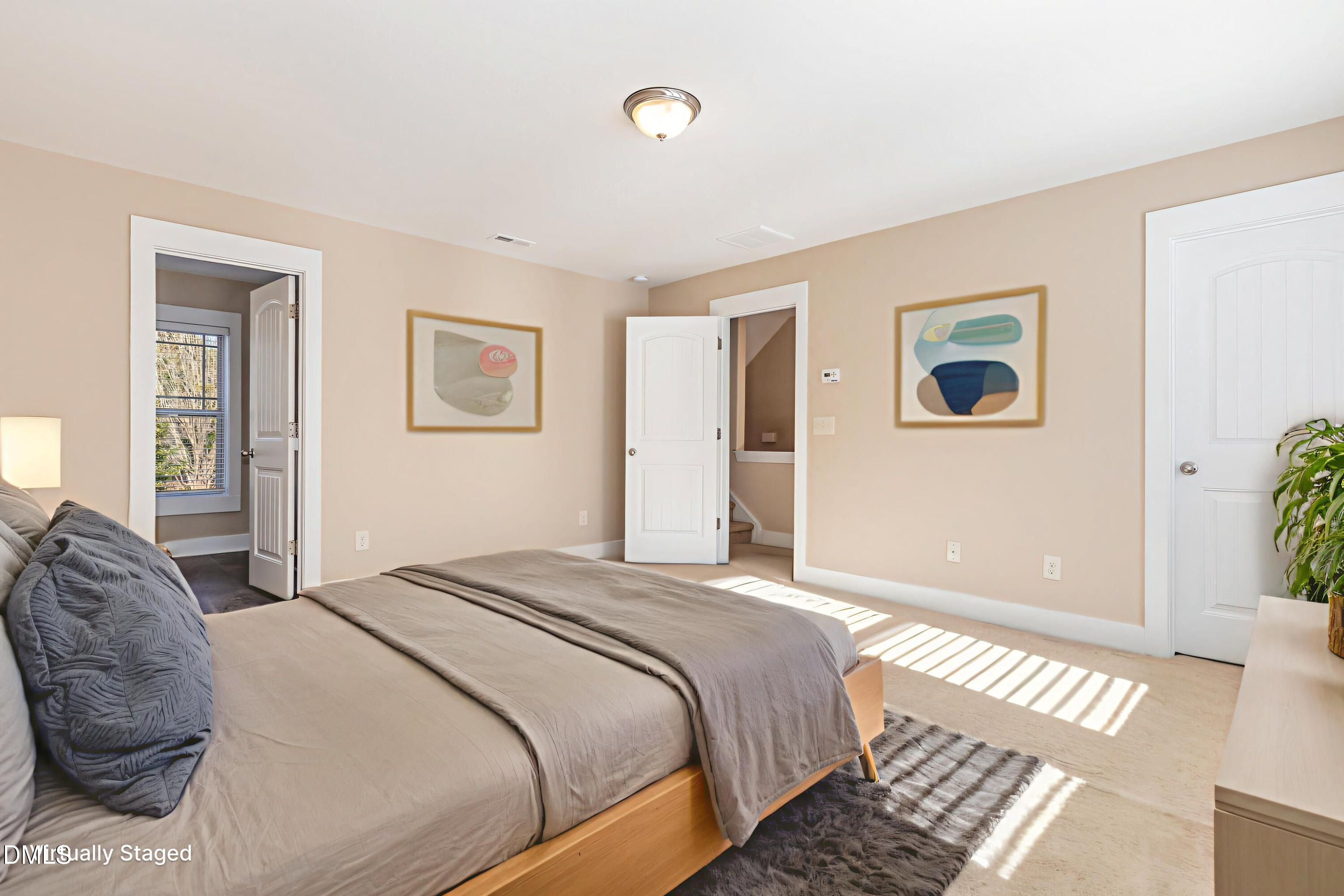 3827 Glenhaven Road Raleigh, NC 27606 - Photo 17 of 32 a bedroom with a large bed and a window