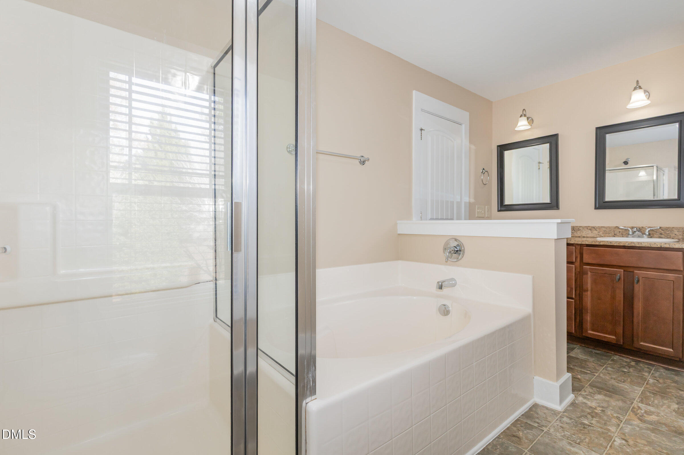 3827 Glenhaven Road Raleigh, NC 27606 - Photo 20 of 32 a bathroom with a bathtub and a sink