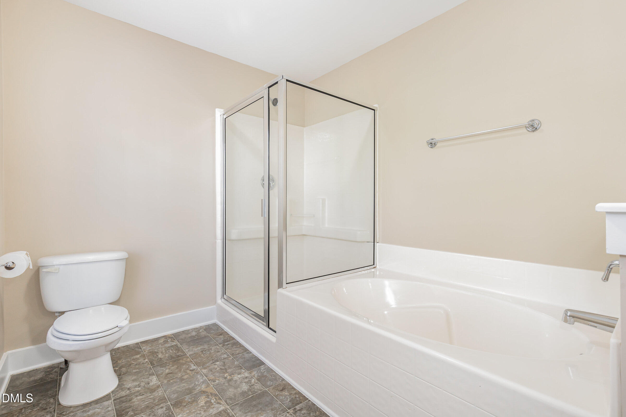 3827 Glenhaven Road Raleigh, NC 27606 - Photo 21 of 32 a bathroom with a toilet and a bathtub