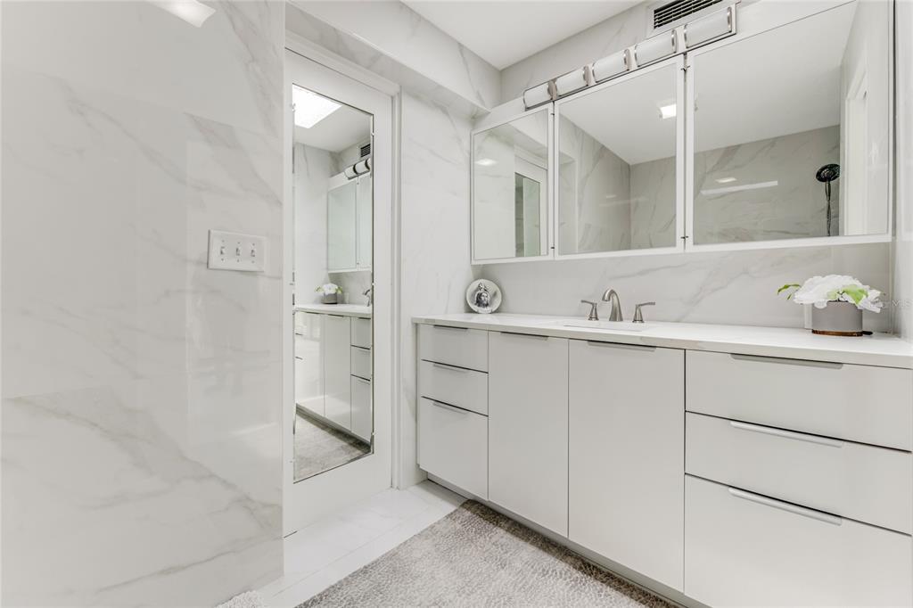 2600 Fort Lane Road Geneva, FL 32732 - Photo 14 of 28 a bathroom with a shower sink and mirror