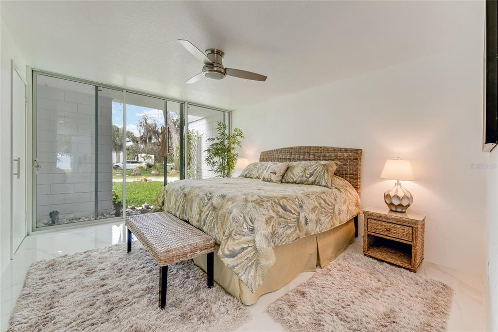 2600 Fort Lane Road Geneva, FL 32732 - Photo 15 of 28 a bedroom with a bed and large windows