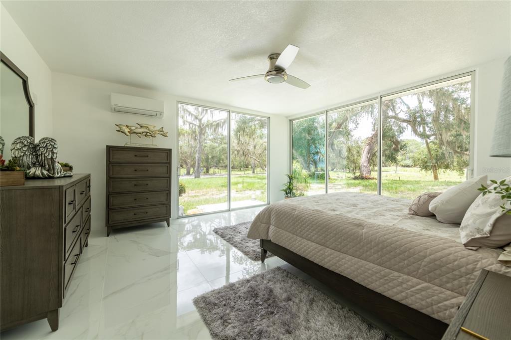 2600 Fort Lane Road Geneva, FL 32732 - Photo 17 of 28 a bedroom with a bed and wooden floor