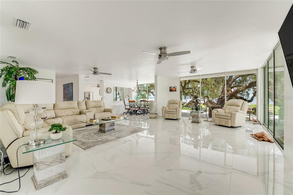 2600 Fort Lane Road Geneva, FL 32732 - Photo 5 of 28 a living room with furniture and a chandelier