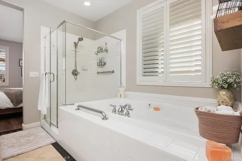 a bathroom with a sink a toilet and shower curtain