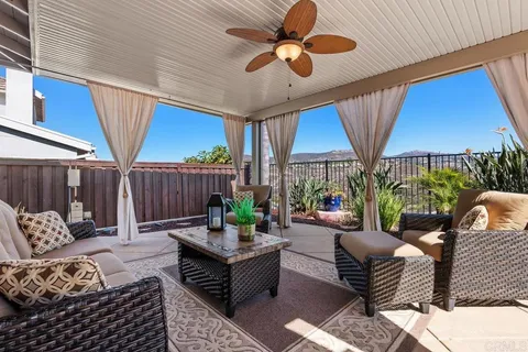 a front view of a house with a garden and plants