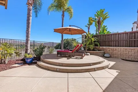 an aerial view of residential building and lake
