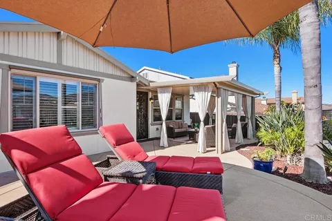 a view of yard with swimming pool and green space